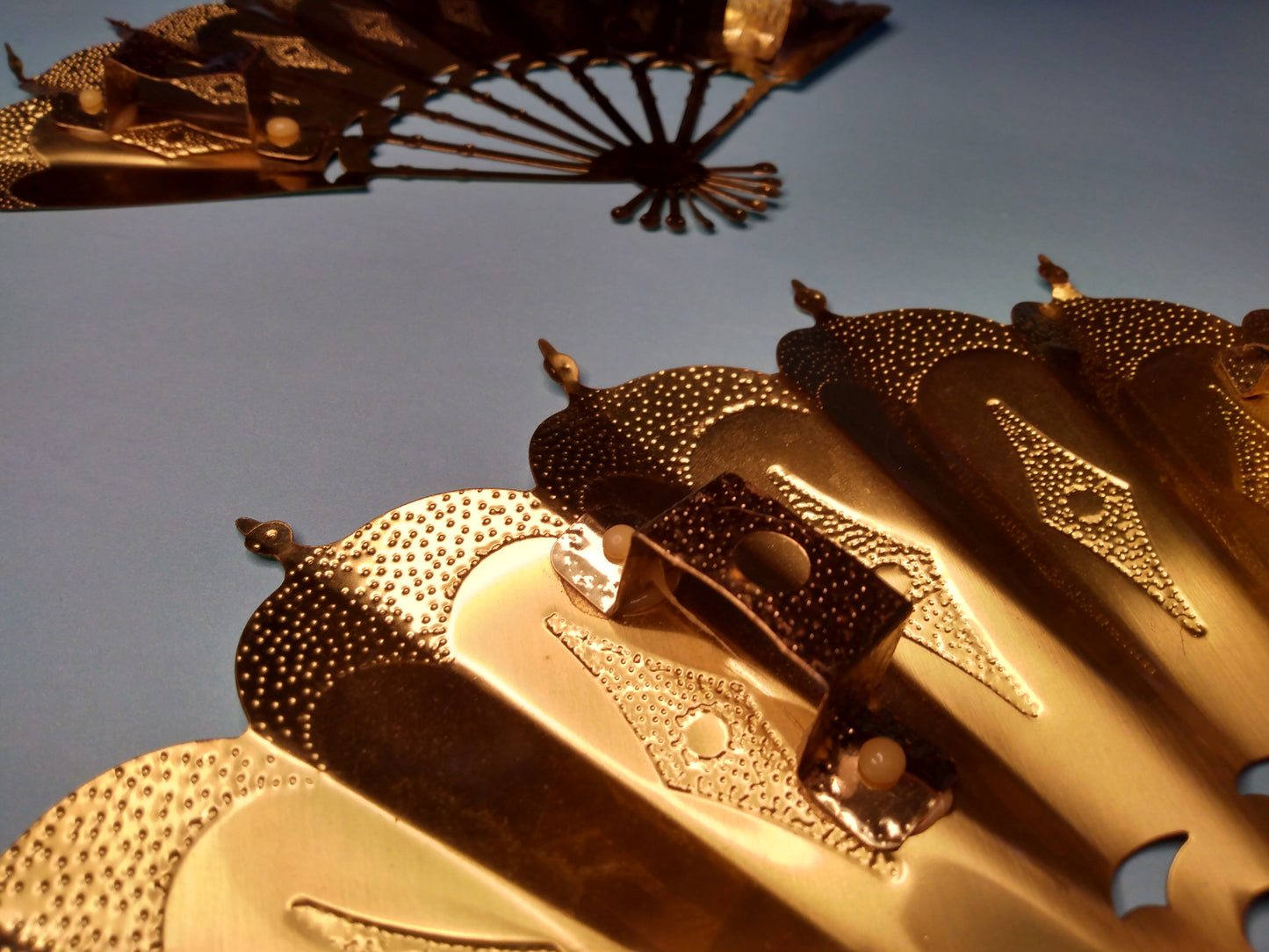 Vintage pair of gold tone fan wall decor