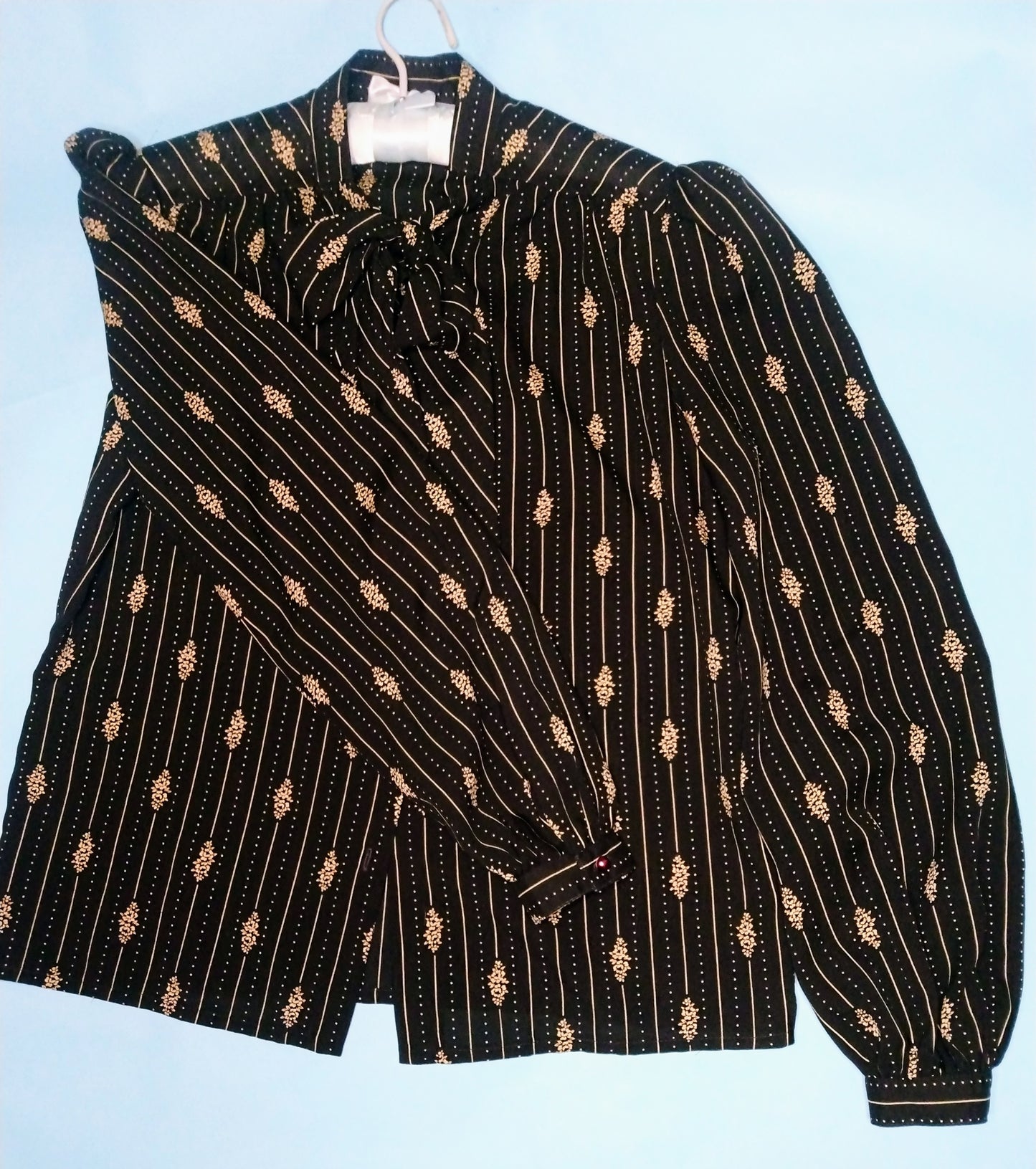 1970s black long sleeve blouse with tie neck