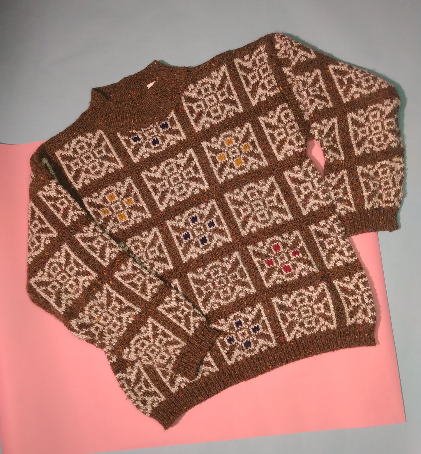 Brown flecked sweater with white geometric pattern