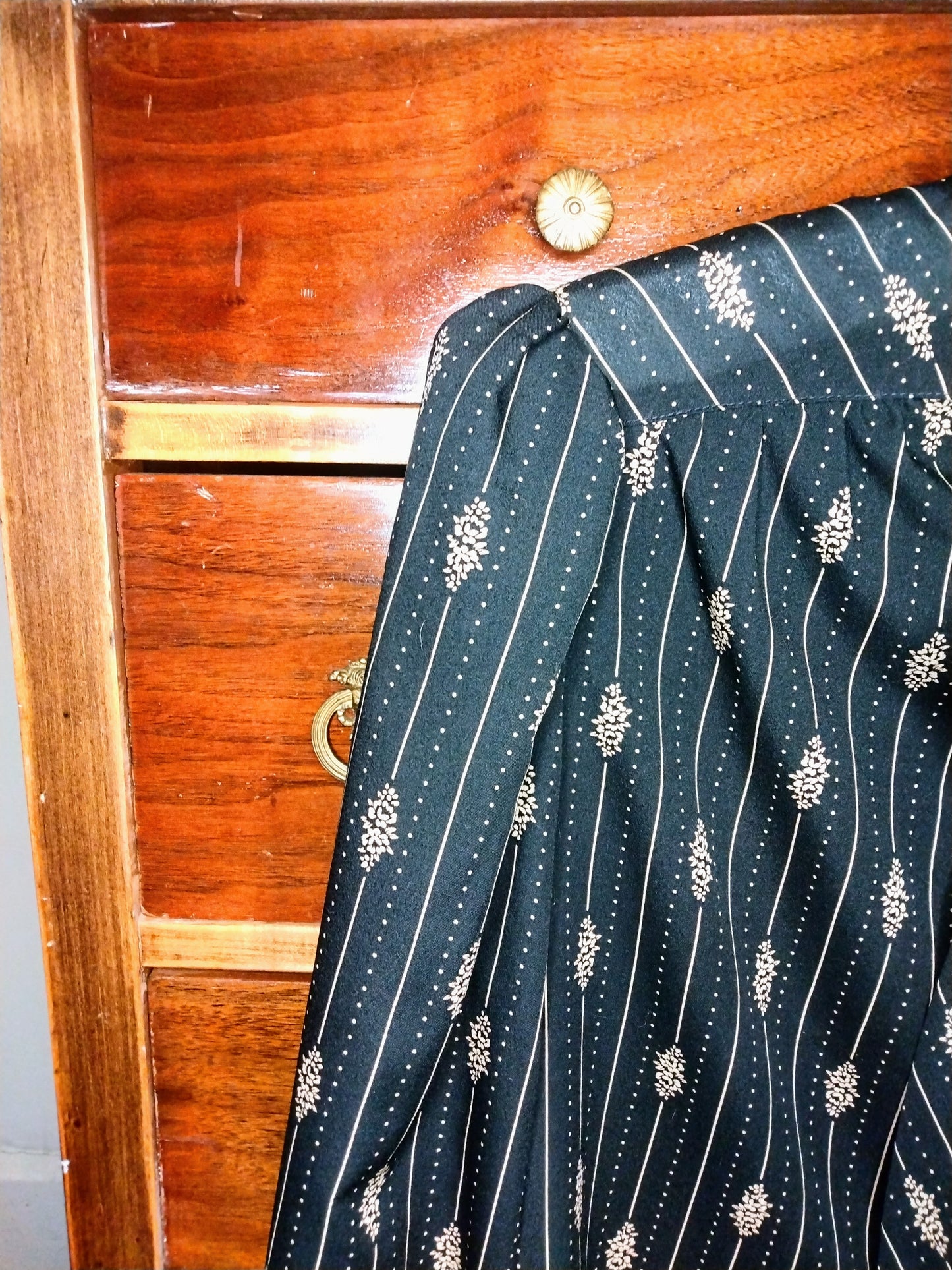 1970s black long sleeve blouse with tie neck