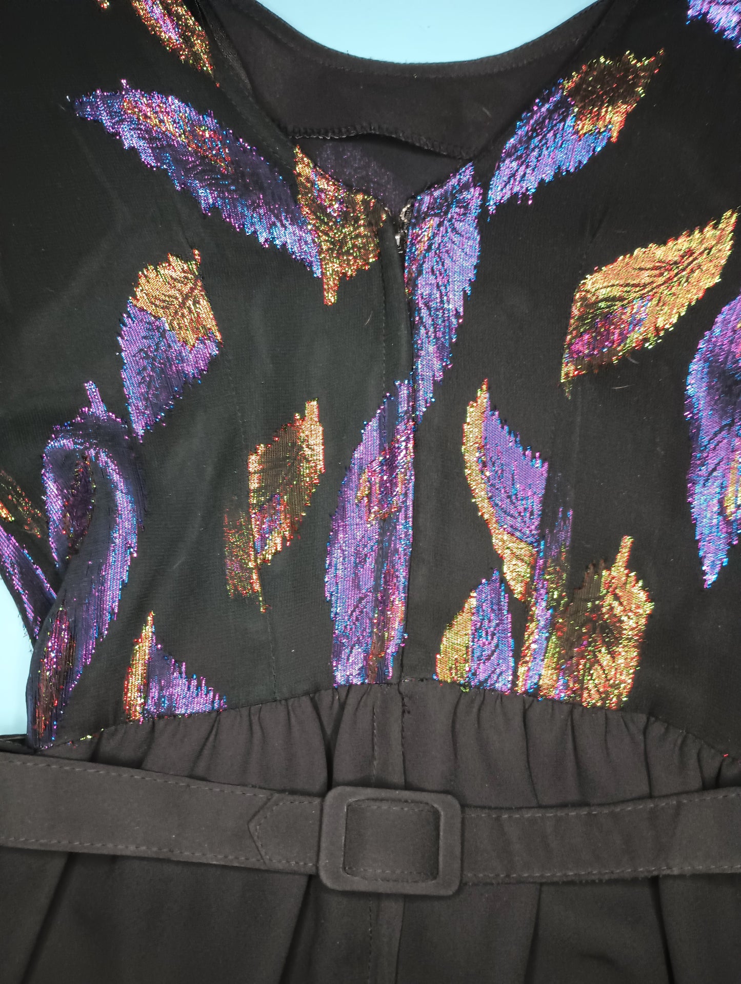 Vintage 1980s cocktail dress with purple and gold iridescent feathers